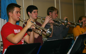 STAY TUNED: Sophomore Nick Pfister (left) rehearses for an upcoming performance on March 13 at Jazz at the Roof. It is one of the most popular band events of the year, which features swing dancing and a sophisticated dinner.