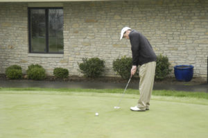 DEAD CENTER: Junior Grant Meade practices stroking a putt during practice. Meade has been one of the top juniors leading the varsity team this season and hopes to help the team under Head Coach Chad Carr perform well heading into the State meet. KATE GRUMME / PHOTO