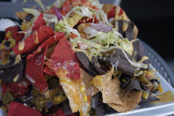 PUT ON YOUR HADHATS: The Construction Nachos at Detour; an American Grille feature a huge amount of toppings. Detour is located in the Carmel Arts and Design District at 110 W. Main St., across the Monon Trail from its closest competitor, Bubs Burgers. AMIRA MACOLM / PHOTO