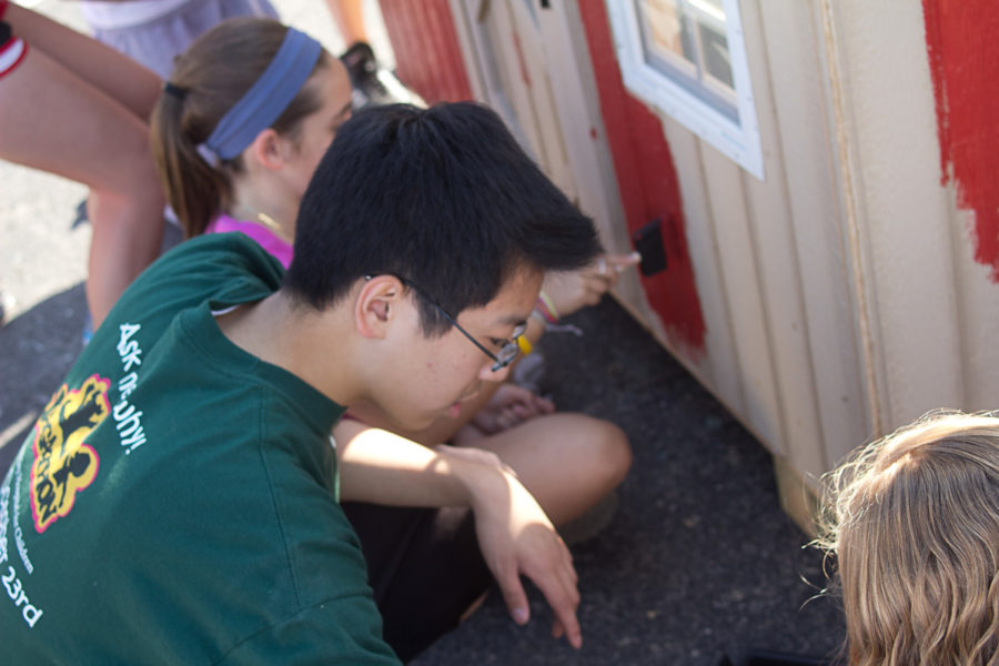 Sophomore Class secretary Joseph Lee helps out with painting during Playhouse Building on Sept. 15. The Sophomore Class auctioned off its playhouse and donated all proceeds to Promising Futures of Central Indiana. DHRUTI PATEL / PHOTO