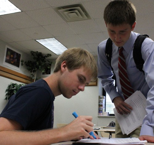 Seniors Brad Kremer (left) and Elliot Browning (right) discuss their plans for DECA this year. Kremer, DECAs secretary, and Browning, DECAs treasureer, will both attend the officers meeting on Sept. 29. PHOTO / SARAH YUN