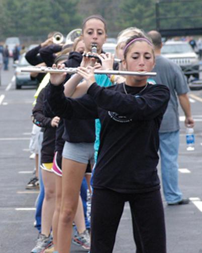 Band members practice their routines for the parade and regular performances after school. The band recently placed third in a national competition at Lucas Oil Stadium.