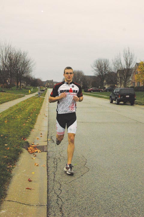 Senior Eric Zigon goes for a run in his neighborhood in order to train. Zigon said that running, along with other types physical conditioning, helped him prepare for the Ironman Louisville triathlon.  