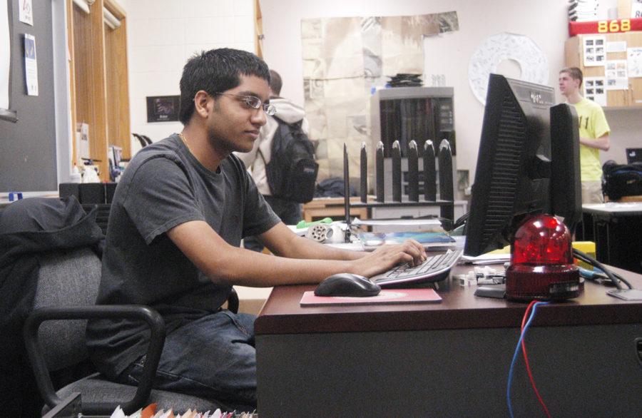 Ateev Gupta, four-year TechHOUNDS member and senior, codes a team project during SRT. According to club sponsor George Giltner, the official build season begins Jan. 7. MELINDA SONG / PHOTO