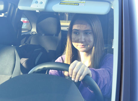 BEEP BEEP: Junior Sydne Horton navigates the streets of downtown Carmel after school.  Horton says a car accident she was in shows that teenagers are more likely to take risks around their peers. Omeed Malekmarzban / Photo