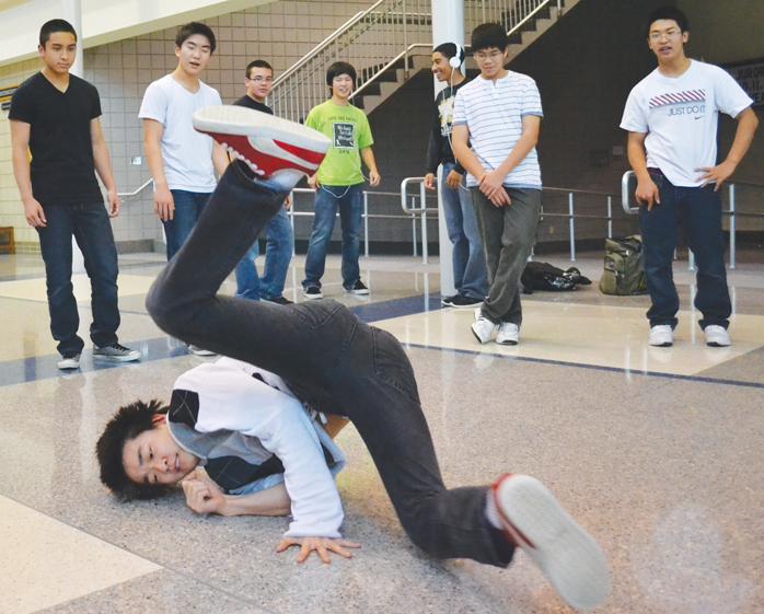 DANCE DANCE REVOLUTION: Leo Kim, hip hop club member and junior, practices his dance moves after school.