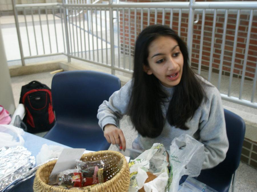 Muslim Student Association member Nida Khan participates in the bake sale, selling items and collecting money in the Freshman Cafeteria. Members of the Muslim Student Association are conducting a bake sale to support victims of Syrian dictator Bashar al-Assad’s recent, brutal crackdown on political protest. ALEX YU / PHOTO