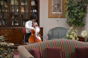 Freshman William Chen plays the first movement of Saint-Saens Cello Concerto in A minor at the Summer Trace nursing home on March 17. Share the Music club members like Chen will play in the Music on Main Street performance in downtown Carmel on April 14. CYNTHIA WU / PHOTO