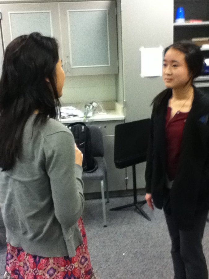 Officer and senior Bella Shu talks to freshman Lauren Lu about the club’s upcoming events, such as Music on Main Street and Houndstock. Lu joined the Share the Music Club at the beginning of the year since she wanted more opportunities to perform and share music with others. ANNI ZHANG / PHOTO