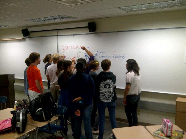 Creative Writing Club members draw on the whiteboard before a meeting. The club meets every Tuesday after school in Room E184. NIDA KHAN/PHOTO
