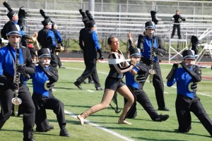 Callie Daet, guard member and junior, opens the show during a performance at the Lawrence Central Invitational. The guard and band captured first-place finishes at this competition as well as the Avon Invitational the previous week. KEVIN ROBERTS / PHOTO