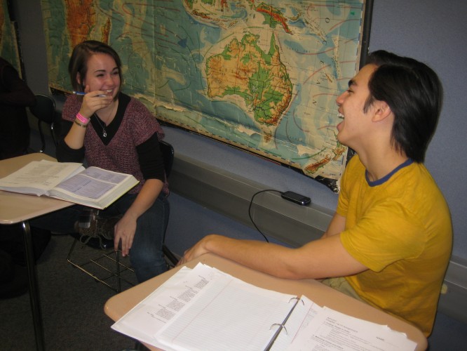 Emma LaPlante and Ian Bossung, Greyhound Connections members and juniors, share a laugh during SRT. Members usually work on homework together while conversing. SHEEN ZHENG / PHOTO