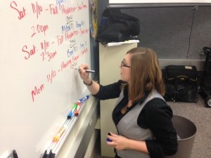 CHTV supervisor Erin Thorpe writes a schedule of CHTVs upcoming events. According to Thorpe, students have mainly prepared for the upcoming basketball season. XU / PHOTO 