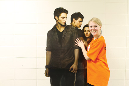 Fang Fan:  Sophomore Vivian Heerens poses with a cutout of the Twilight main characters. The new movie will premiere tomorrow.