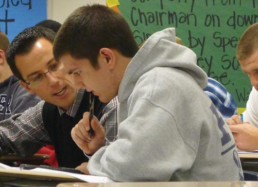 Personal finance teacher Richard “Chard” Reid works closely with senior Christopher Bonta. Reid, who ran for U.S. Congress in the Nov. 6 election, said even though he ran for office, he tried to keep his personal political views out of the classroom.