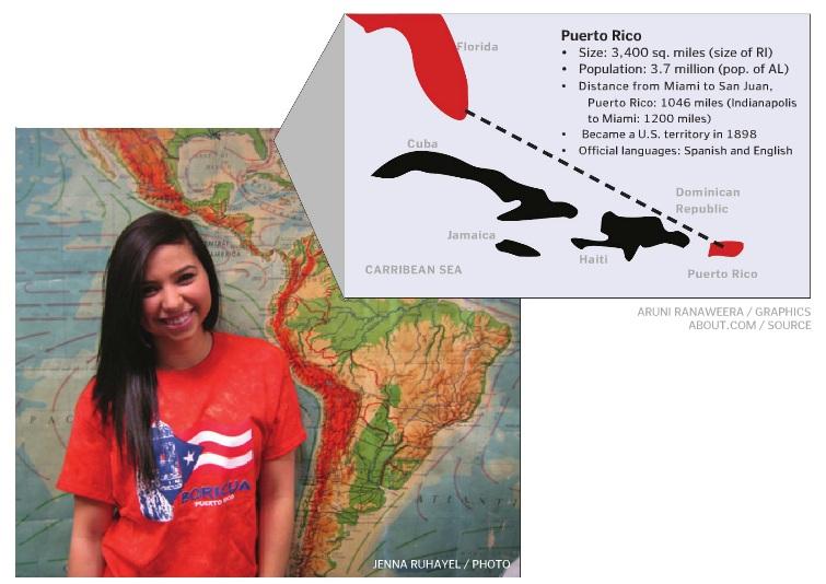 Sarina Salazar, Puerto Rican and senior, poses in front of a map of the region. Puerto Rico is on the path to statehood, but factors such as cultural identity prevent it from officially becoming the fifty-first state. JENNA RUHAYEL/ PHOTO