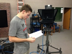 Cam Glass, advanced telecommunications student and senior, reads over the script for a video for
video project for the Indiana Association School Broadcasters (IASB) competition. According to CHTV supervisor Erin Earnest, all CHTV classes
are working on submissions for the (IASB) contest on March 4, in
which students enter their work to compete in different broadcasting categories. XU / PHOTO