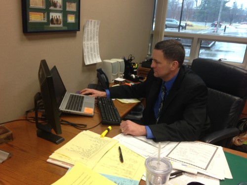 Assistant Principal Doug Bird prepares an email for the School Messenger system. According to Bird, the school uses the School Messenger system to inform parents via email and phone call about severe weather and other important reminders pertaining to the school. CLAUDIA HUANG / PHOTO
