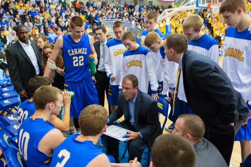 Coach Heady talks to the varsity mens basketball team during a timeout. KYLE CRAWFORD / PHOTO