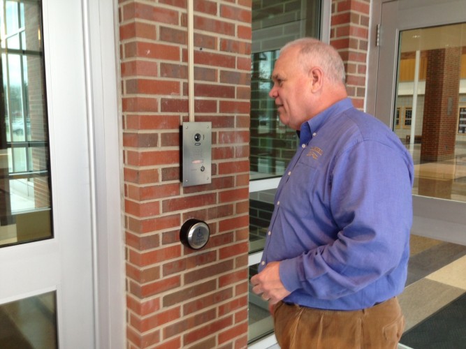 Principal John Williams speaks into the new doorbell notification system. The procedure, at first scheduled to be implemented next school year, was enacted on April 15. VICTOR XU / PHOTO