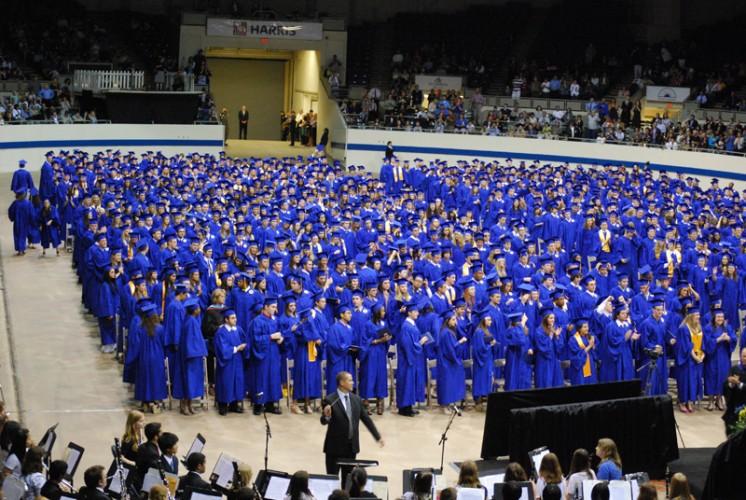 Seniors from the Class of 2012 applaud after a rendition of the Star Spangled Banner. Unlike last year’s commencement at the Pepsi Coliseum, this year’s ceremony will be held at the Indiana Convention Center. VICTOR XU / PHOTO