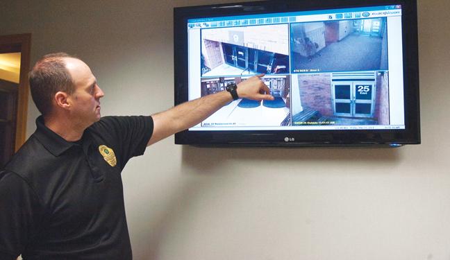 School resource officer Phil Hobson observes security camera footage. According to Hobson, the school’s resource unit does not plan on adding security cameras. PHOTO / SAM PATTERSON 