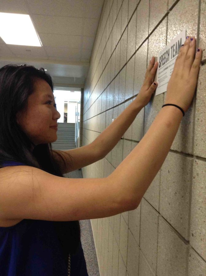 Elaina Xiong, senior and speech team leader, is distributing flyers to advertise the speech team callout meeting. According to Xiong, several former speech team members will perform at the callout meeting. 