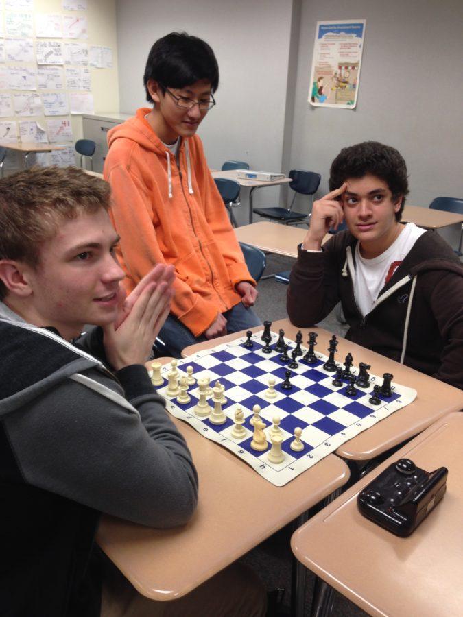 Blake+Patteson%2C+club+member+and+senior%2C+oversees+a+game+of+chess+between+members+and+seniors+Omar+Elshay+and+Shizen+Moh.+The+three+said+they+enjoyed+the+club+trip+to+Dairy+Queen+and+plan+on+purchasing+club+T-shirts.+ASTER+SAMUEL+%2F+PHOTO