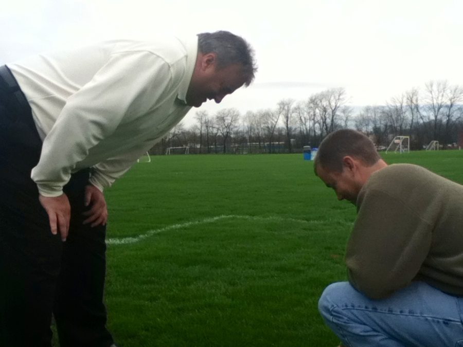 Jack Beery, Carmel Dads Club president, and Josh Blackmore, Carmel Dads Club facilities superintendent, examine field damage caused by weather at Badger Fields. Beery said the new turf will be able to prevent this kind of damage. “(Artificial turf) allows us to play on the fields regardless of weather,” Beery said. “In the spring especially, we had a very rainy, wet spring. So, we could not get on the fields. With turf, weather like this won’t affect it like it does on regular grass turf fields.” CHRISTINE FERNANDO / PHOTO