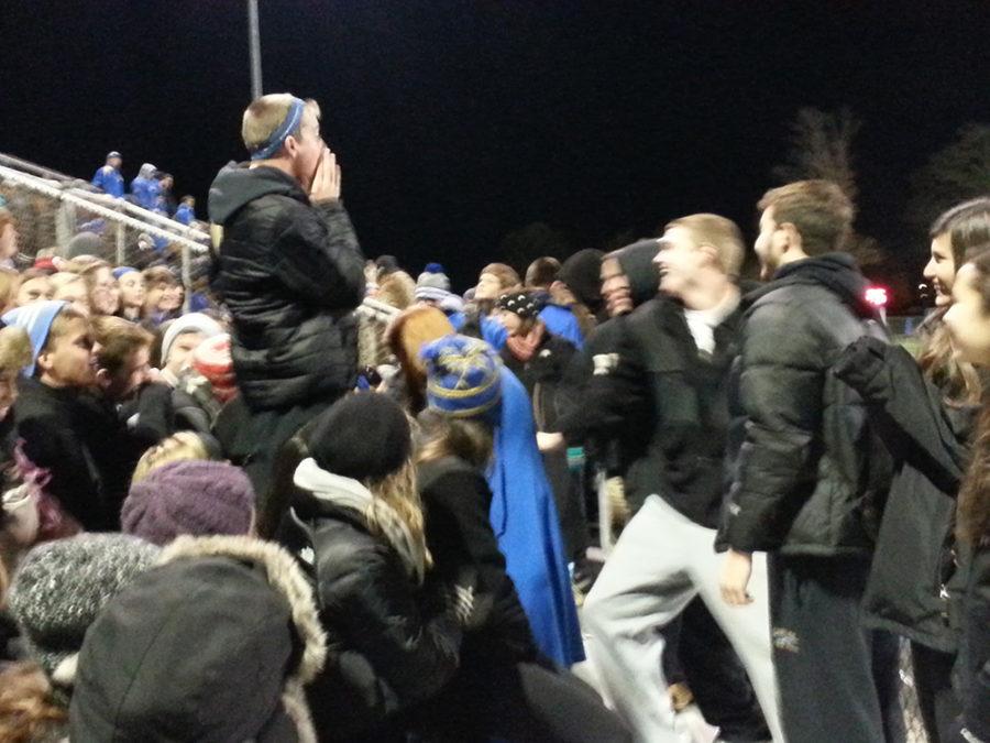Nicky Jasin, co-president of Big Game and senior, leads a chant at a football game at Hamilton Southeastern on Oct. 25. In his role with Big Game, Jasin has injected energy into other students. JASON KLEIN / PHOTO