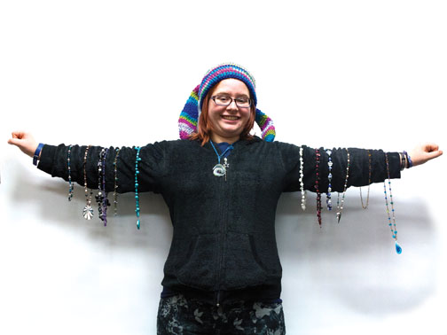 Junior Jessica Earnhardt displays some of her handmade jewelry and crocheted items. Earnhardt says she loves working with her hands and has too many creations to keep.  KYLE CRAWFORD / PHOTO 