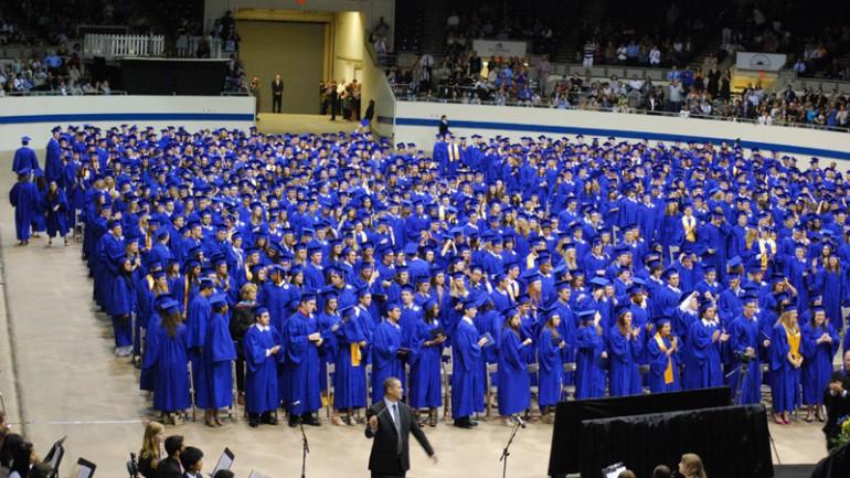 The Class of 2012 stands for the national anthem during the graduation ceremony.