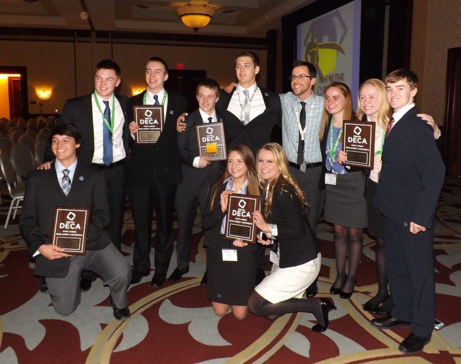 Richard Reid, DECA sponsor and business teacher, stands with several students who qualified for the International Career Development Conference for DECA (ICDC). In total, 32 students at CHS qualified for the conference. RICHARD REID / SUBMITTED PHOTO 