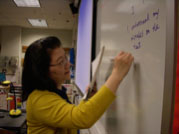 Chinese teacher Tungfen Lee prepares for lesson plans for the day. Over the past several weeks, Lee discussed the Chinese language and cultural fair with her students and helped them prepare for the contests and activities. SARAH TINAPHONG / PHOTO