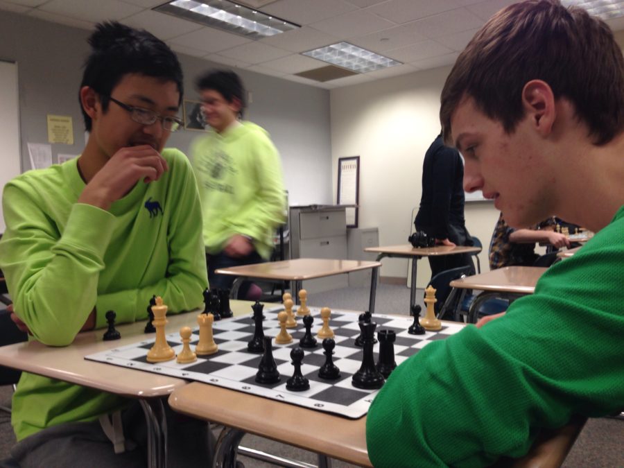 Sophomore Joe Philleo plays chess with junior Kevin Mi. Both club members will be representing CHS at the team state tournament on March 22. ASTER SAMUEL / PHOTO