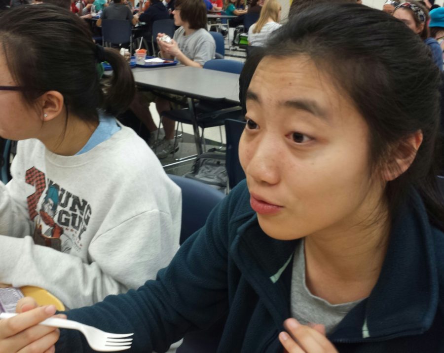 In the main cafeteria, Jackie Hu, Philosophy Club member and sophomore, talks with friends while eating lunch. Hu said, “People are busy with different things. But for each person that doesn’t go (to the meeting), that’s another perspective we don’t hear.”