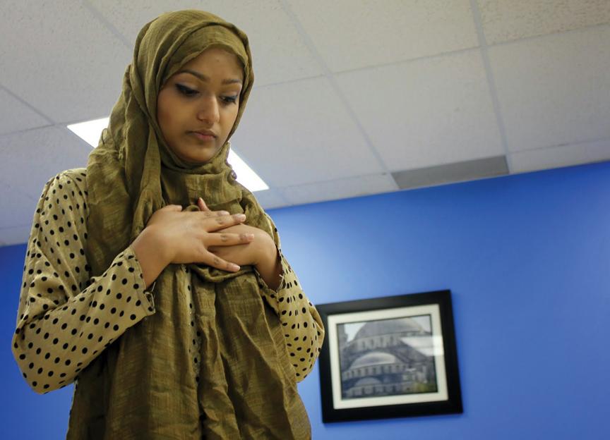 CLOSE UP: Senior Syma Bari casts her eyes downwards when she prays, indicating respect. Bari said, “I feel like Islam is portrayed negatively in the media, especially after 9/11.” NIVEDHA MEYYAPPAN / PHOTO