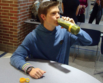Junior Cole Stark drinks green juice in the morning before school in Greyhound Station to energize for the day. Green juice consists of many different fruits and vegetables, most commonly lettuce, and it is a way to get quick absorption of the nutrients from produce.