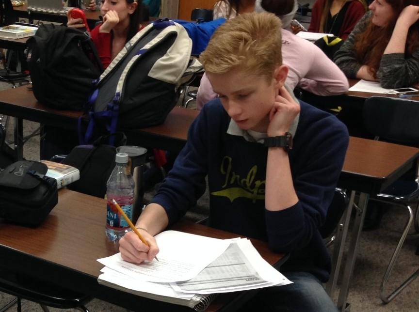 Sophomore Class president Jordan JD Arland works on homework assignments in his CHTV classroom. Arland said he wants to increase student turnout and revenue for the Sophomore Class in this semester.