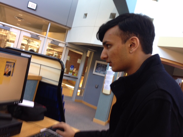 Senior Class president Krishna Pathak works on homework at the library. Pathak said the Senior Class will be inactive until prom, but also that each class has periods of activity and inactivity.