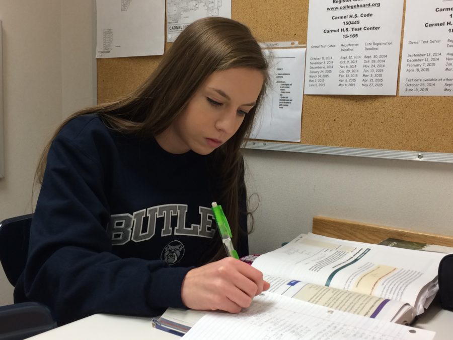 Senior Katie Popcheff works on her homework during third period as a nurses’ aid. Popcheff said, “I’d say (we get jobs from the nurses) about…once a period, during this period. It’s mostly studying and (doing) homework, but if I get that done, then I’ll, like, read or something.”
