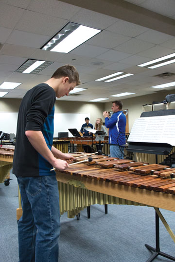 Senior Aaron McGhiey plays the marimba when practicing for the 2015 percussion concert as a freshman. McGhiey said the concert is a great opportunity for older percussionists to work with younger students. 