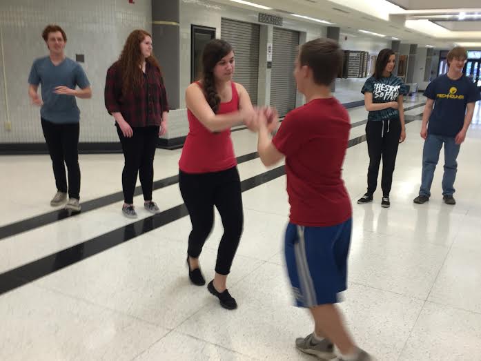Member and junior Royce McConnell and member and sophomore Isabella Campins practice the step called the snowball. The Swing Club plans to have their club dance on May 1 in the community room. SITHA VALLABHANENI