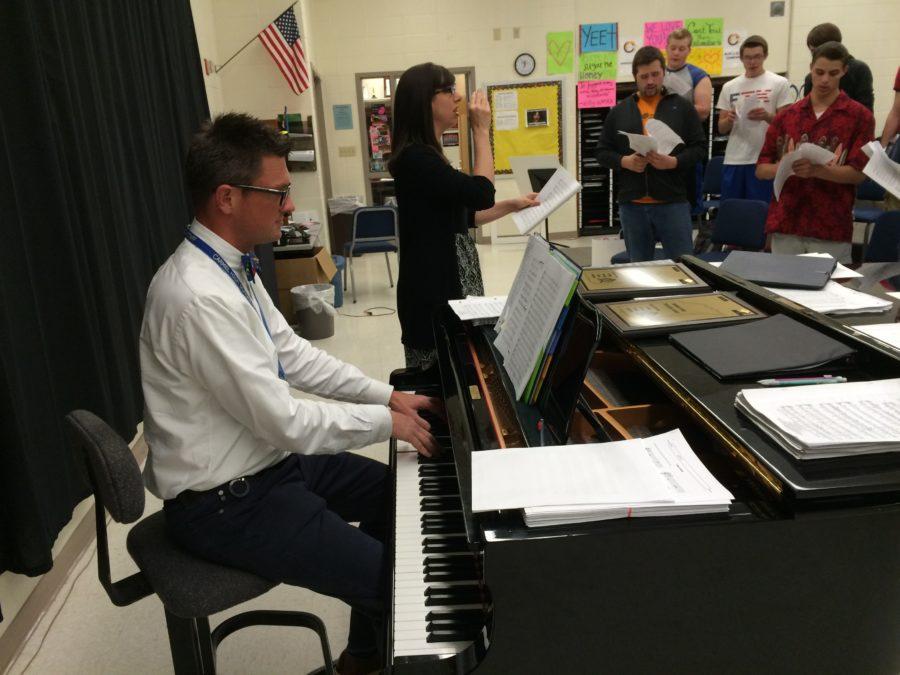 Head choir director John Burlace plays the piano as co-director Kathrine Kouns guides the voices of the choir’s many ensemble members. Just days away from the Spring Concert on May 20, the choir looks to make a lasting impression during their last performance of the year.