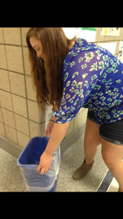 Elizabeth Baach, president and junior, empties out a recycling bin. “I joined this club as a sophomore and fell in love with the idea that I could make an impact in our community,” Baach said. 