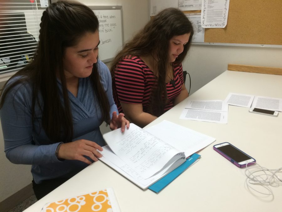 Claudia Shelbourn, nurse’s aide and senior, and Alyssa Tooley, nurse’s aide and senior, work on homework during their period as nurses’ aides. Shelbourn said, “I’m interested in the medical profession when I’m older, so I chose to be a nurse’s aide. Plus, my schedule is really hectic this year, so it’s kind of nice to have kind of a free period to kind of just chill and also get work done.”