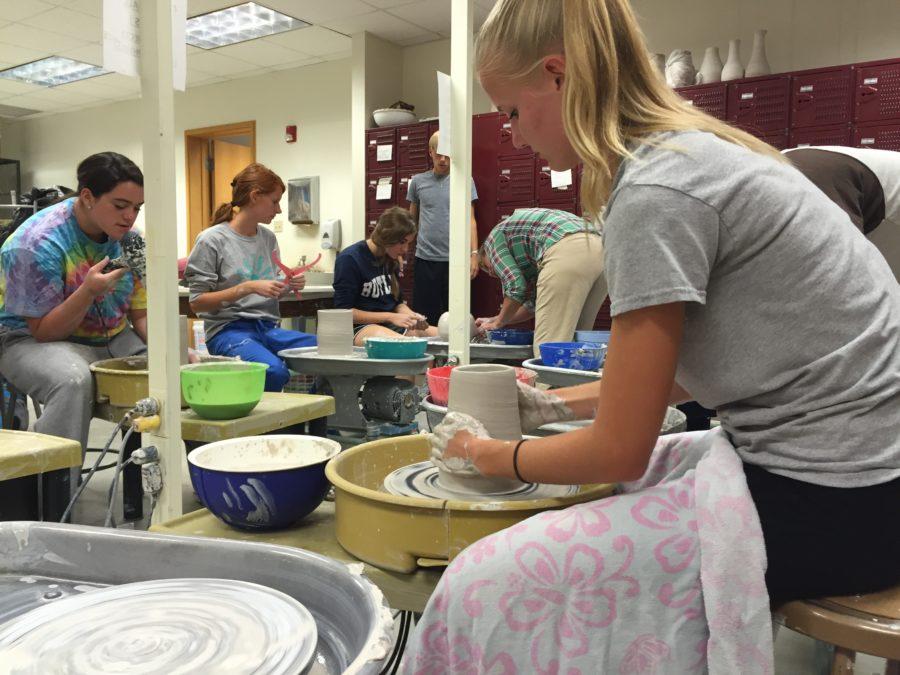 Senior Sydney Peterson uses the wheel to make a pot in Ceramics 5. The students will combine thrown and hand-build techniques in their first project.​