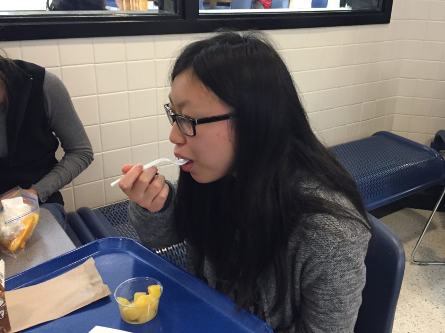 Carly Chia, vice president of Typography and Design Club and sophomore, eats lunch with her friends. She said she hopes to find events for students to be interested in the joining the club. PHOTO/ JASMINE LAM
