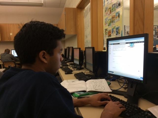 Planning for the upcoming “Agent Recycle” project, senior Vikas Maturi, this year’s co-president of Design for CHS, edits and updates the information of this project.  Design for CHS has its own website that contains all the information of all its recent projects. DARRELL CHENG / PHOTO