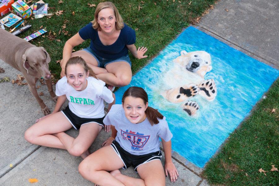ART ON THE SIDEWALK: Senior Kate Bruns and freshman Claire Bruns are a family of chalk artists